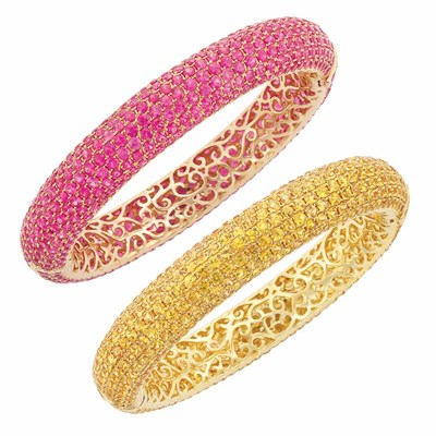 Lot 211 - Pair of Gold and Pink and Yellow Sapphire Bombe Bangle Bracelets