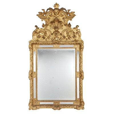 Lot 158 - Regence Style Giltwood Mirror The shaped 18th...