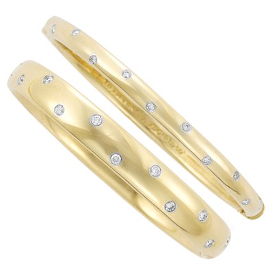 Lot 188 - Two Gold, Platinum and Diamond 'Etoile' Bangle Bracelets, Tiffany & Co.
