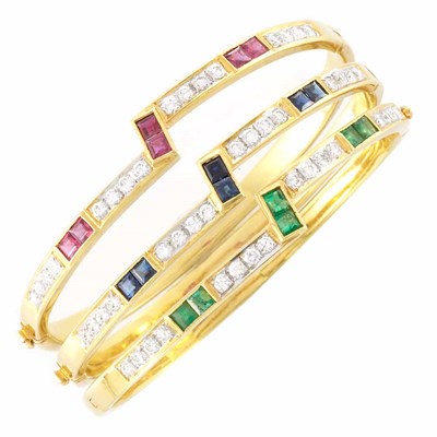 Lot 307 - Three Gold, Diamond and Gem-Set Bangle Bracelets