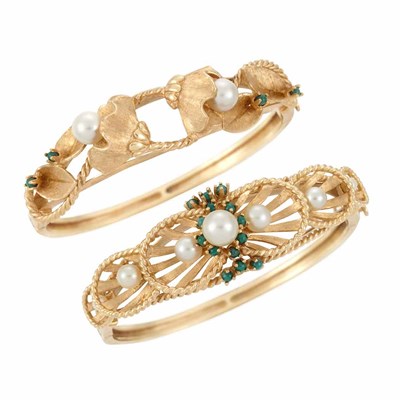 Lot 556 - Two Gold, Cultured Pearl and Emerald Bangle Bracelets