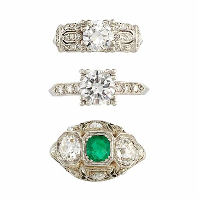 Lot 760 - Two Platinum and Diamond Rings and White Gold, Diamond and Emerald Ring