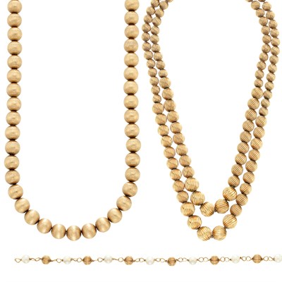 Lot 555 - Double Strand Fluted Gold Bead Necklace, Gold Bead Necklace and Gold Bead and Simulated Cultured Pearl Bracelet