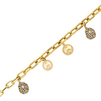 Lot 828 - Gold, Blackened Gold, Golden Cultured Pearl, Diamond and Yellow Sapphire Charm Bracelet