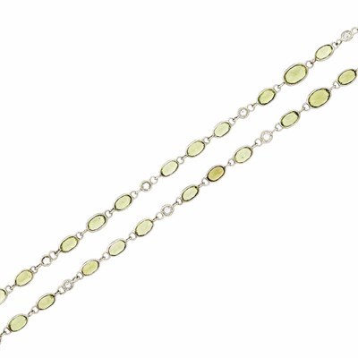 Lot 452 - Long White Gold, Peridot and Diamond Chain Necklace