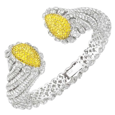 Lot 168 - White Gold, Diamond and Fancy Colored Yellow Diamond Bangle Bracelet