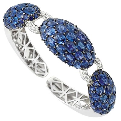 Lot 156 - White Gold, Sapphire and Diamond Bangle Bracelet
