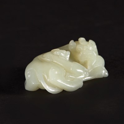Lot 348 - Chinese Celadon Jade Qilin Group The recumbent...