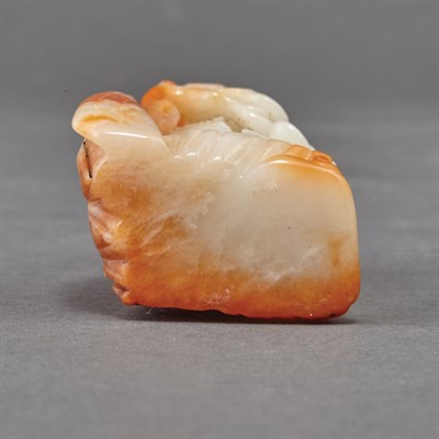 Lot 356 - Chinese Celadon and Russet Jade Carving Of...