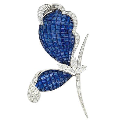 Lot 384 - Platinum, Invisibly-Set Sapphire and Diamond Flower Clip-Brooch, France