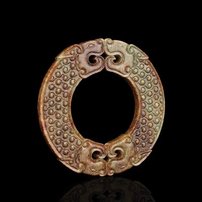 Lot 215 - Chinese Celadon and Russet Jade Archaistic Bi...