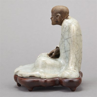 Lot 283 - Two Seated Celadon Glazed Porcelain Buddhas...
