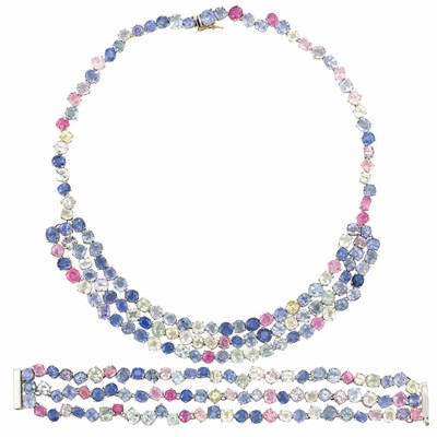 Lot 95 - White Gold and Multicolored Sapphire Swag Necklace and Triple Strand Bracelet