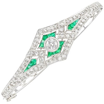 Lot 1073 - Platinum, Diamond and Emerald Bangle Bracelet