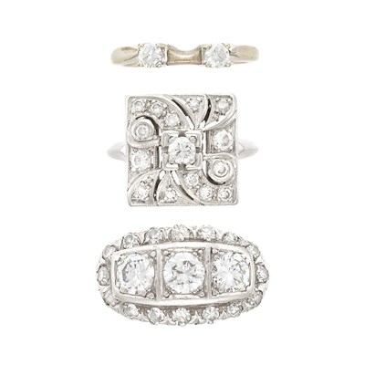 Lot 1337 - Two Platinum and Diamond Rings, White Gold and Diamond Guard Ring