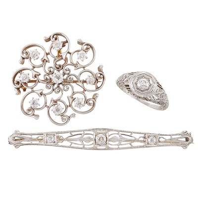Lot 1335 - Two-Color Gold and Diamond Pendant-Brooch, White Gold and Diamond Bar Pin and Platinum and Diamond Ring