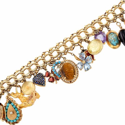 Lot 1429 - Gold and Gem-Set Charm Bracelet