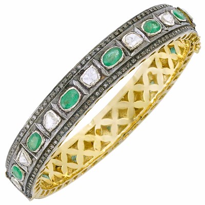 Lot 3102 - Silver-Topped Gold, Foiled-Back Diamond and Emerald Bangle Bracelet