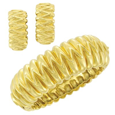 Lot 195 - Gold Bangle Bracelet and Pair of Hoop Earrings