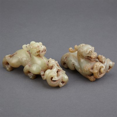 Lot 124 - Two Chinese Archaic Style Celadon Jade Qilin...