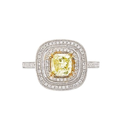 Lot 3089 - White and Yellow Gold, Fancy Yellow Diamond and Diamond Ring