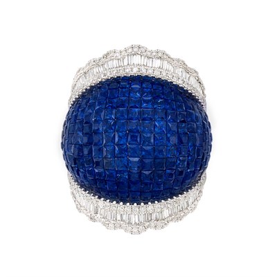 Lot 351 - Wide White Gold, Invisibly-Set Sapphire and Diamond Bombe Ring