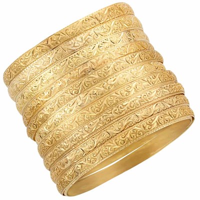 Lot 3041 - Eleven Gold Bangle Bracelets