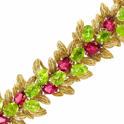 Lot 233 - Gold, Peridot and Garnet Bracelet