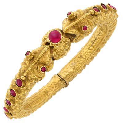 Lot 34 - Antique Indian High Karat Gold and Cabochon Ruby Animal Head Bangle Bracelet