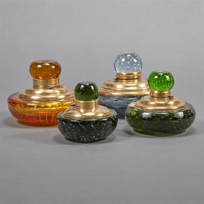 Lot 566 - Four Brass Mounted Colored Glass Inkwells Each...
