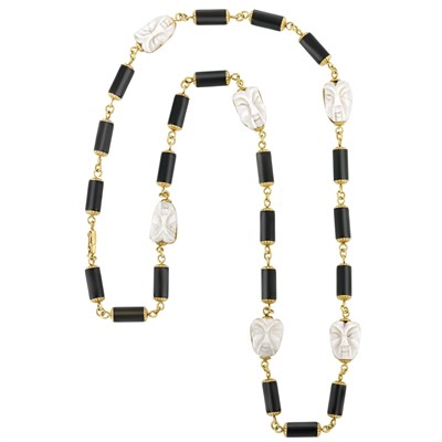 Lot 297 - Long Gold, Black Onyx and Carved White Coral Necklace