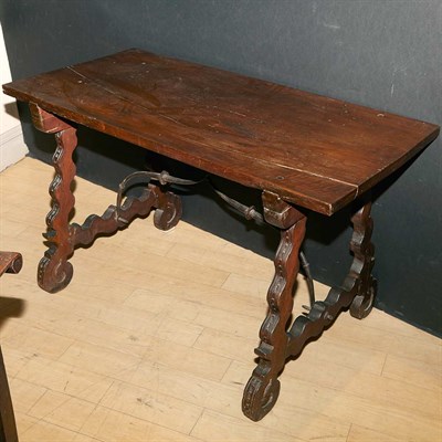 Lot 278 - Spanish Walnut and Wrought Iron Trestle Table...