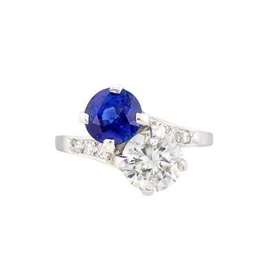 Lot 165 - Platinum, Sapphire and Diamond Crossover Ring, Lambert Bros.