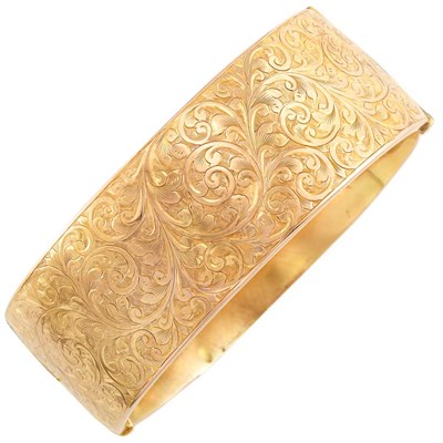 Lot 24 - Low Karat Engraved Gold Bangle Bracelet