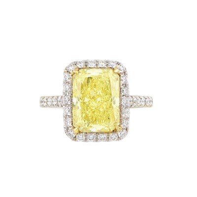 Lot 318 - Two-Color Gold, Fancy Light Yellow Diamond and Diamond Ring