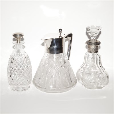 Lot 441 - Three Sterling Silver and Cut Glass Decanters...