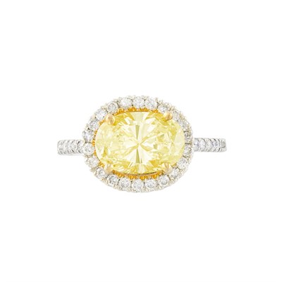 Lot 169 - Two-Color Gold, Yellow Diamond and Diamond Ring