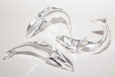 Lot 414 - Three Baccarat Glass Figures of Dolphins...