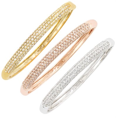 Lot 284 - Three Tricolor Gold and Diamond Bangle Bracelets