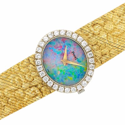 Lot 391 - Two-Color Gold, Opal and Diamond Wristwatch, Piaget