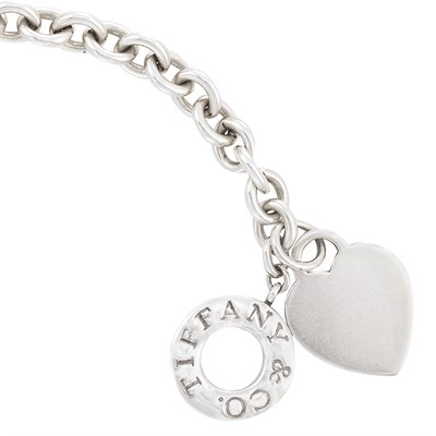 Lot 1115 - Silver Flexible Bracelet with charm attached,...