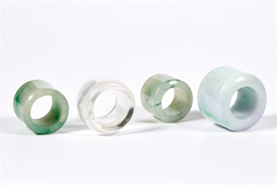Lot 65 - Group of Three Chinese Jadeite Archer's Rings;...