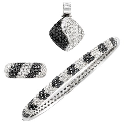 Lot 111 - White Gold, Diamond and Black Diamond Bangle Bracelet, Ring and Pendant