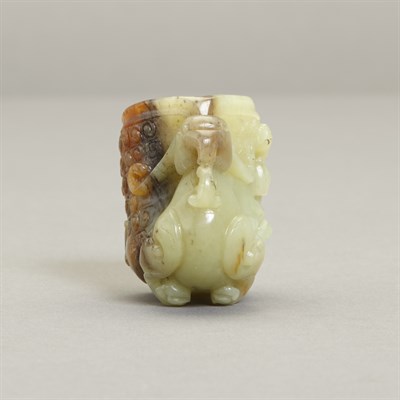 Lot 150 - Chinese Celadon and Russet Jade Rhyton Cup The...