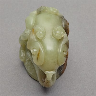Lot 150 - Chinese Celadon and Russet Jade Rhyton Cup The...