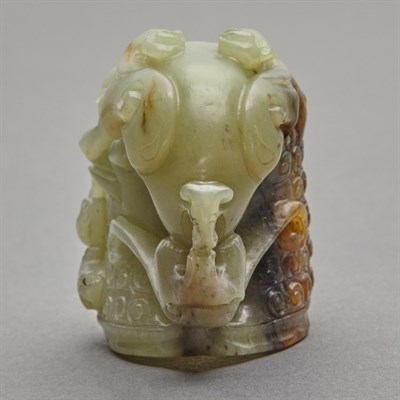 Lot 150 - Chinese Celadon and Russet Jade Rhyton Cup The...