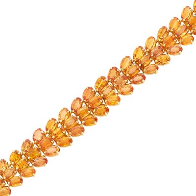 Lot 388 - Gold and Orange Sapphire Bracelet