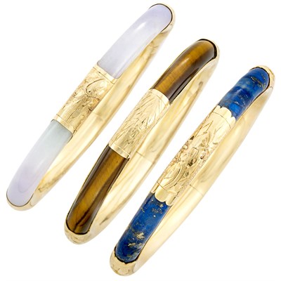 Lot 511 - Three Gold, Tiger's Eye, Lapis and Lavender Jade Bangle Bracelets