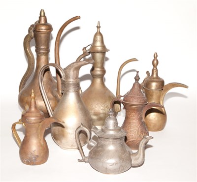 Lot 143 - Group of Seven Middle Eastern Metal Ewers and...
