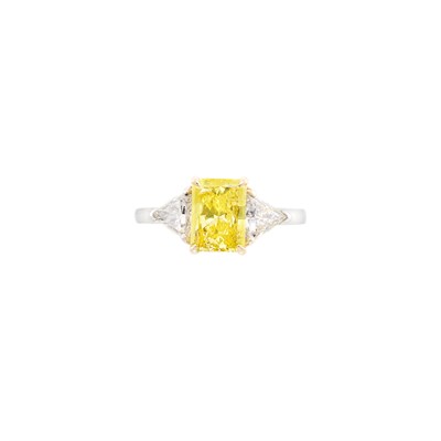 Lot 449 - Platinum, Gold, Fancy Vivid Yellow Diamond and Diamond Ring